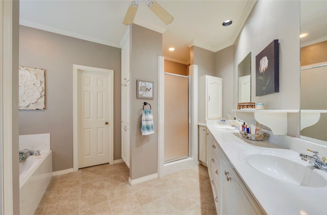 1400 Gun And Rod Road Brenham, TX 77833 - Photo 13 of 23 a bathroom with a double vanity sink mirror and shower