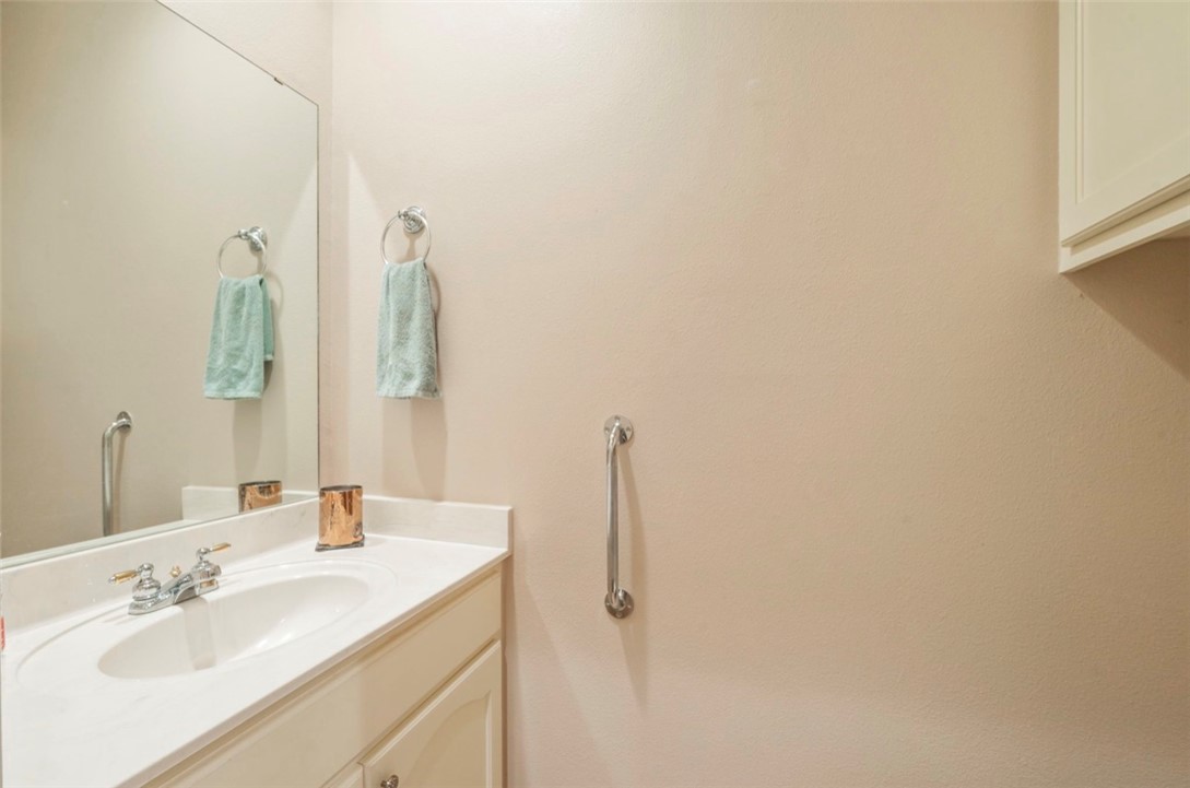 1400 Gun And Rod Road Brenham, TX 77833 - Photo 15 of 23 a bathroom with a sink and mirror