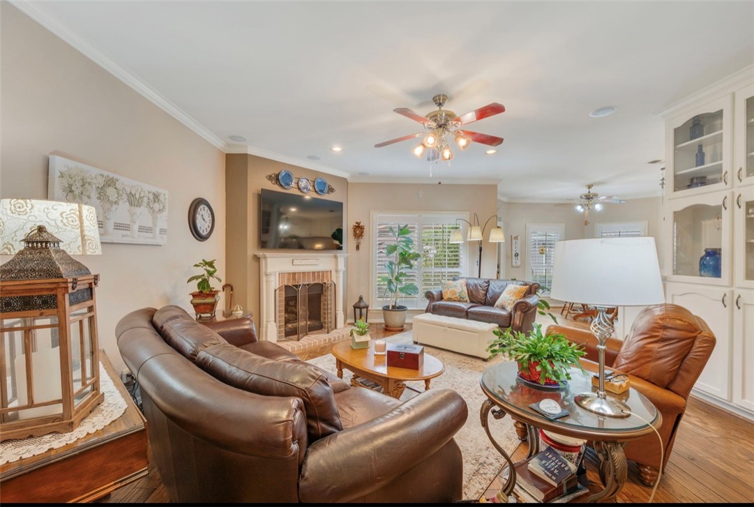 1400 Gun And Rod Road Brenham, TX 77833 - Photo 4 of 23 a living room with fireplace furniture and a flat screen tv