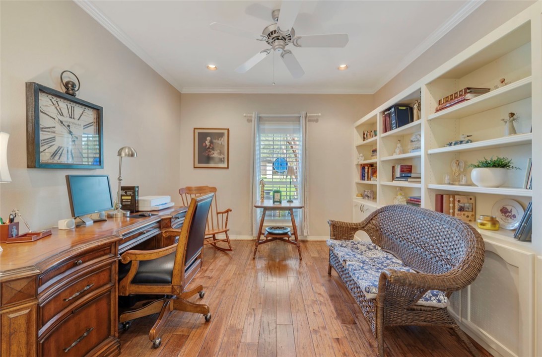 1400 Gun And Rod Road Brenham, TX 77833 - Photo 8 of 23 a view of a workspace with furniture and wooden floor
