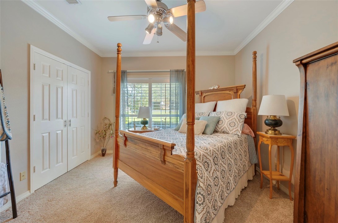 1400 Gun And Rod Road Brenham, TX 77833 - Photo 9 of 23 a bed room with a bed and a chair