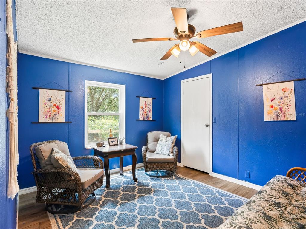 17090 Southeast 173rd Terrace Road Weirsdale, FL 32195 - Photo 21 of 54 a living room with furniture and a window
