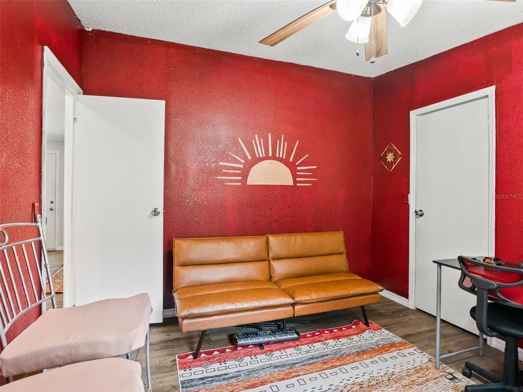 17090 Southeast 173rd Terrace Road Weirsdale, FL 32195 - Photo 26 of 54 a living room with furniture and a rug