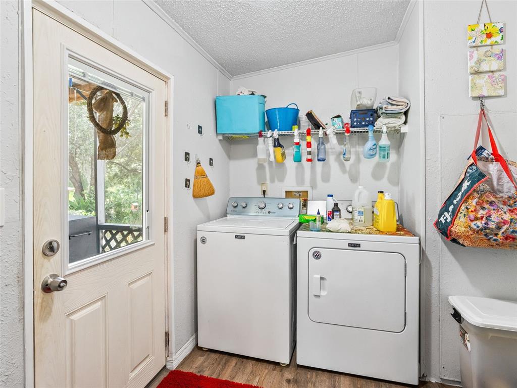 17090 Southeast 173rd Terrace Road Weirsdale, FL 32195 - Photo 27 of 54 a utility room with dryer and washer