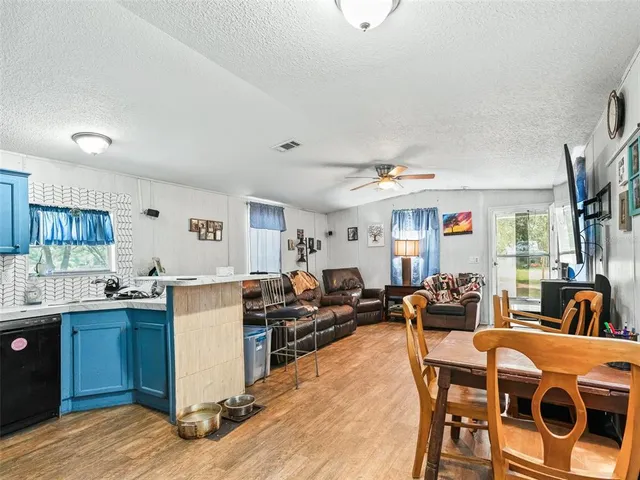 a bathroom with a sink and mirror with toilet