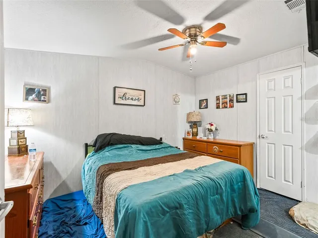 a view of walk in closet and storage