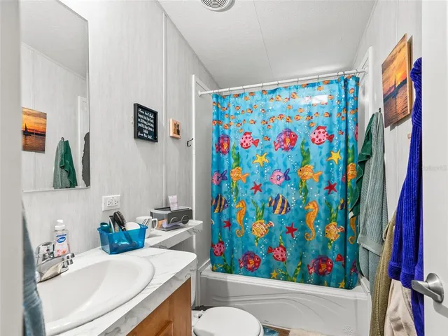 a view of a garden with large trees