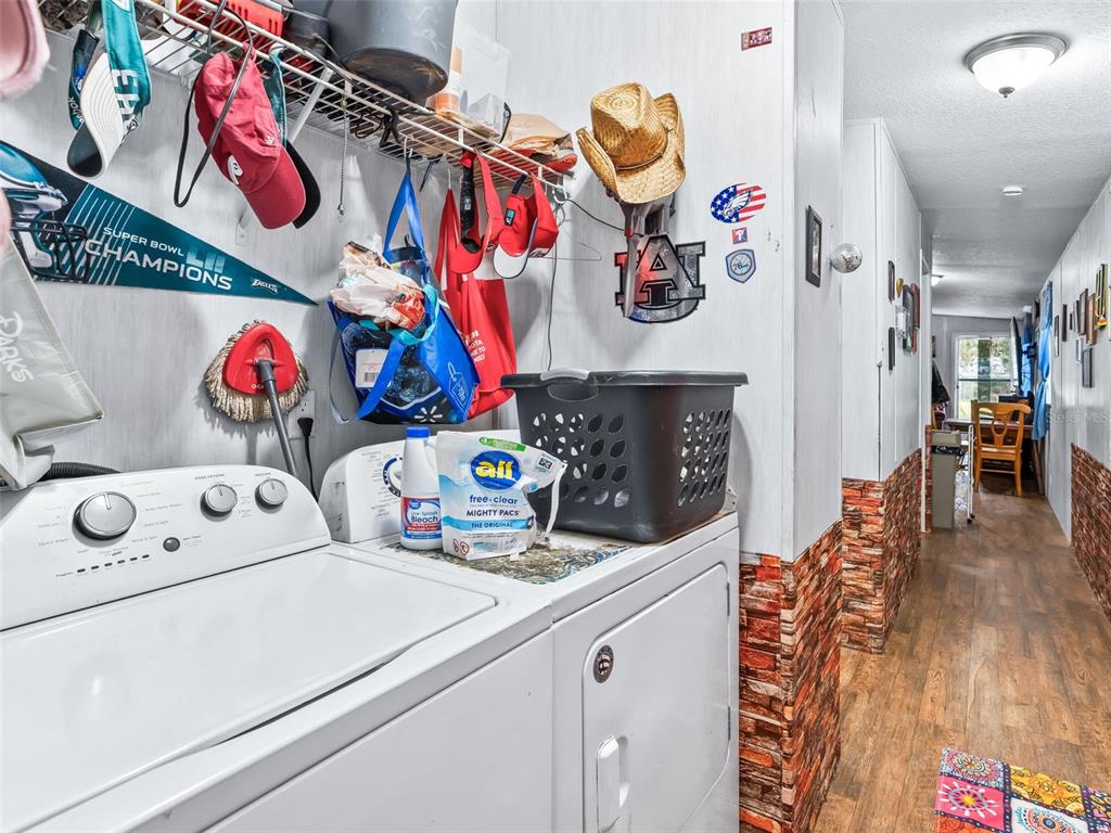 17090 Southeast 173rd Terrace Road Weirsdale, FL 32195 - Photo 40 of 54 a utility room with dryer and washer