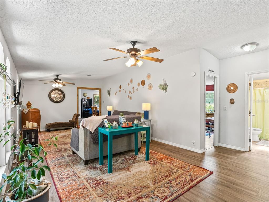 17090 Southeast 173rd Terrace Road Weirsdale, FL 32195 - Photo 5 of 54 a living room with furniture and a table