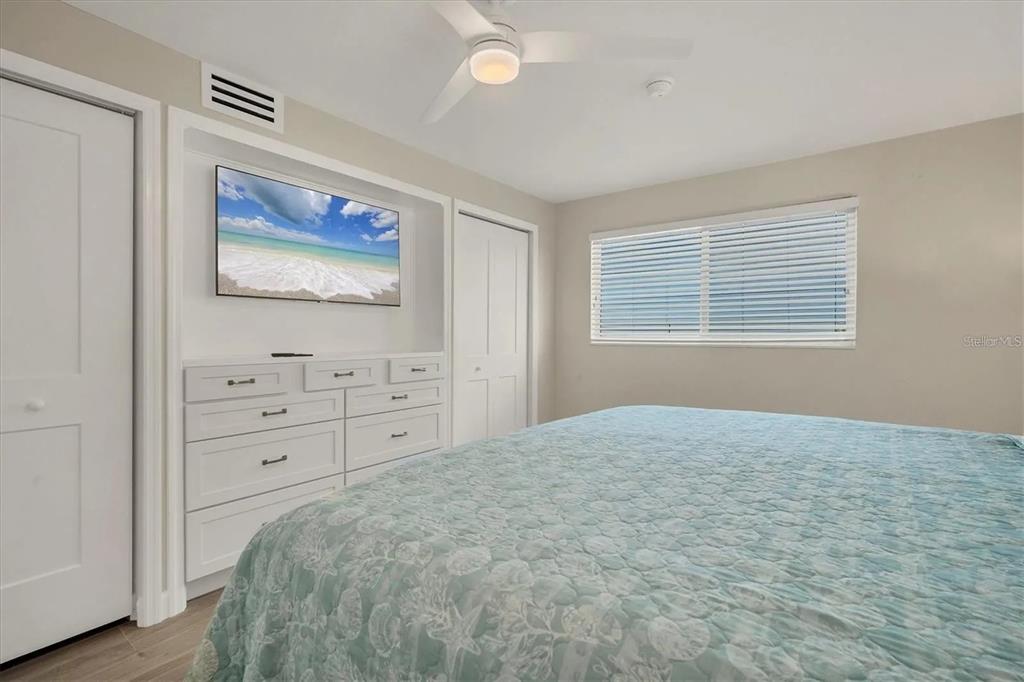 6006 Midnight Pass Road, Unit 36 Sarasota, FL 34242 - Photo 17 of 43 a bedroom with a bed and a window