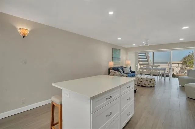 a view of living room with furniture and wooden floor