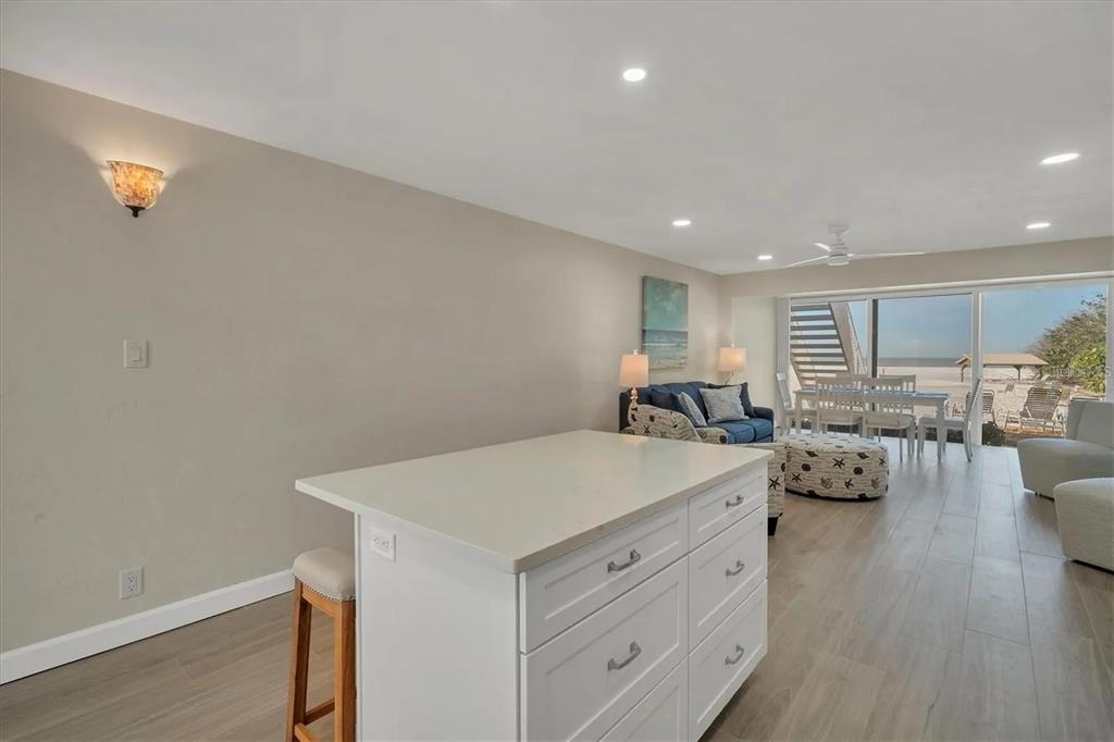 6006 Midnight Pass Road, Unit 36 Sarasota, FL 34242 - Photo 9 of 43 a view of living room with furniture and wooden floor