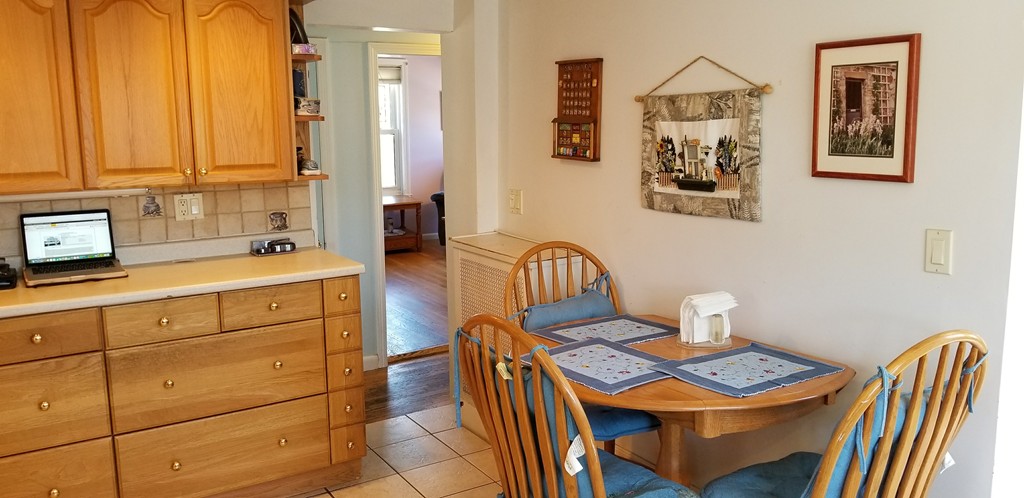 58 Dearborn Street Medford, MA 02155 - Photo 12 of 30 a kitchen that has a sink and a table in it