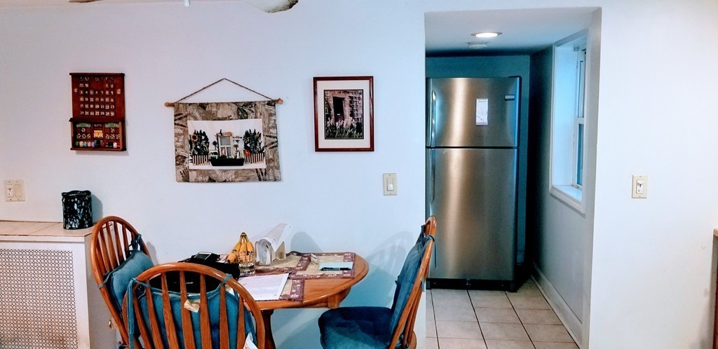 58 Dearborn Street Medford, MA 02155 - Photo 15 of 30 a view of a dining room with furniture and window