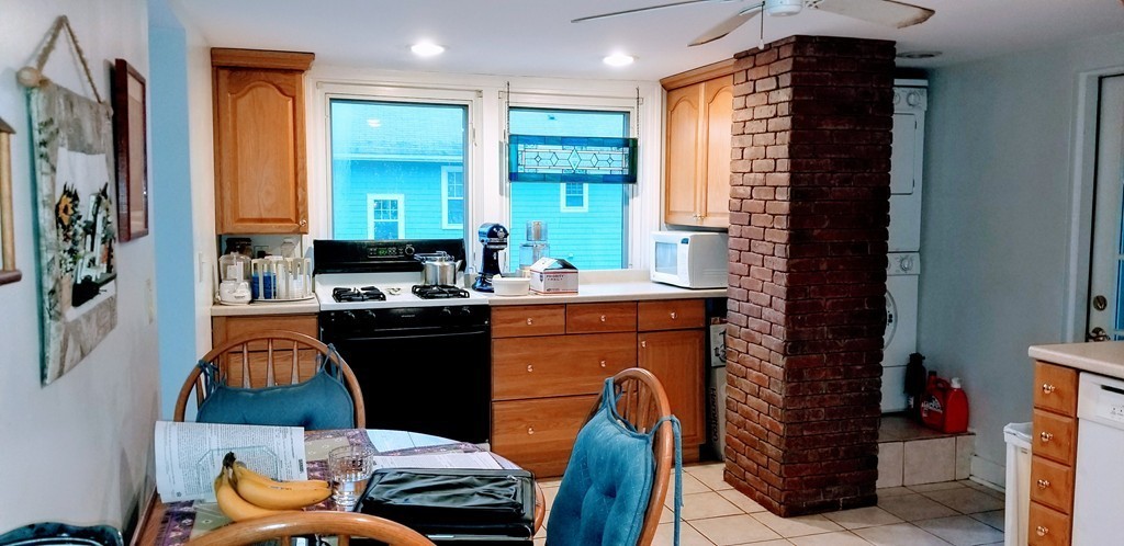 58 Dearborn Street Medford, MA 02155 - Photo 16 of 30 a kitchen with a refrigerator and a stove