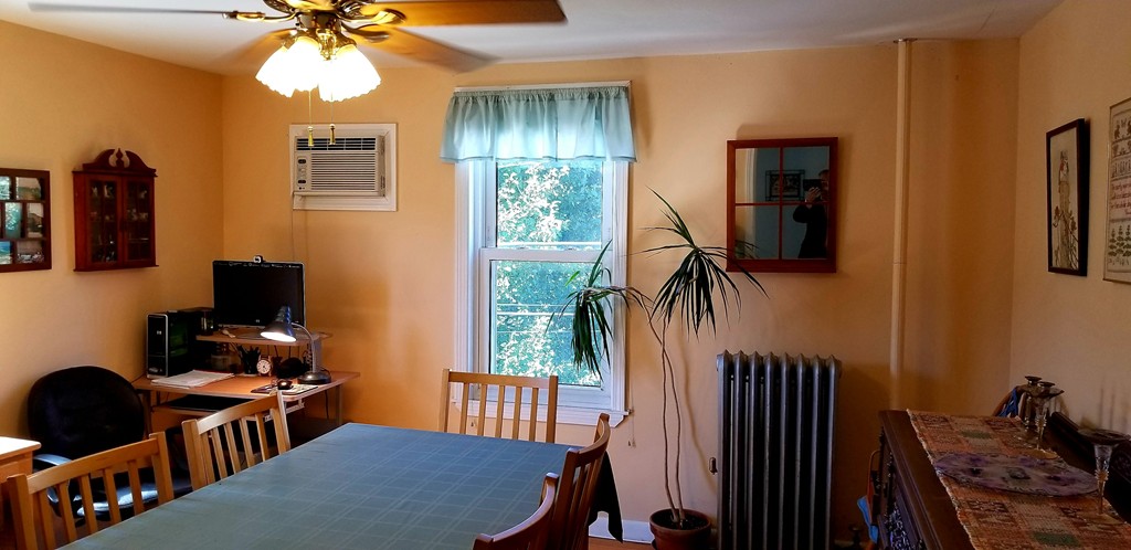 58 Dearborn Street Medford, MA 02155 - Photo 17 of 30 a workspace with furniture hardwood and a window