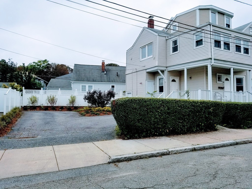 58 Dearborn Street Medford, MA 02155 - Photo 2 of 30 a front view of a house with a yard