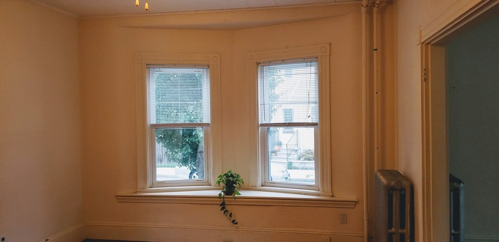 58 Dearborn Street Medford, MA 02155 - Photo 21 of 30 a view of an empty room with a window