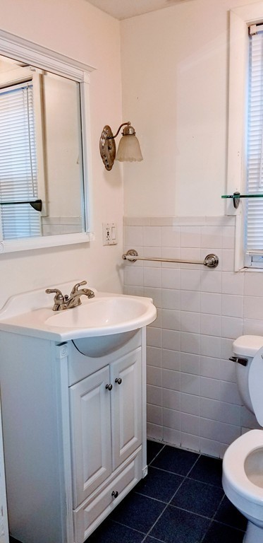 58 Dearborn Street Medford, MA 02155 - Photo 23 of 30 a bathroom with a sink toilet and mirror