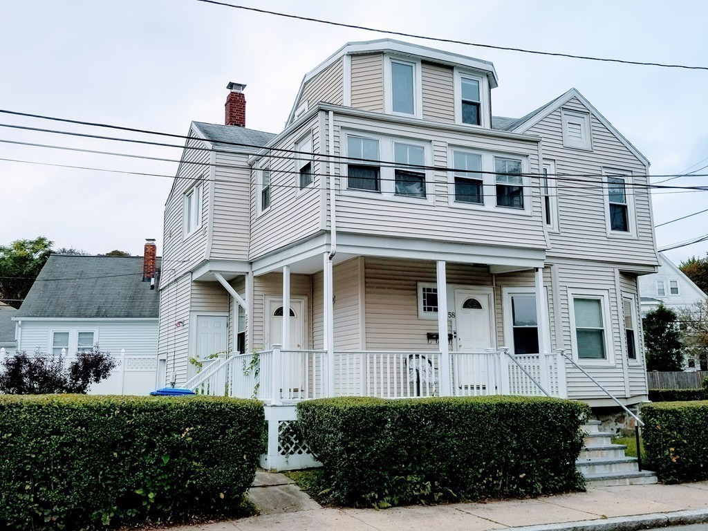 58 Dearborn Street Medford, MA 02155 - Photo 5 of 30 a front view of a house with a garden