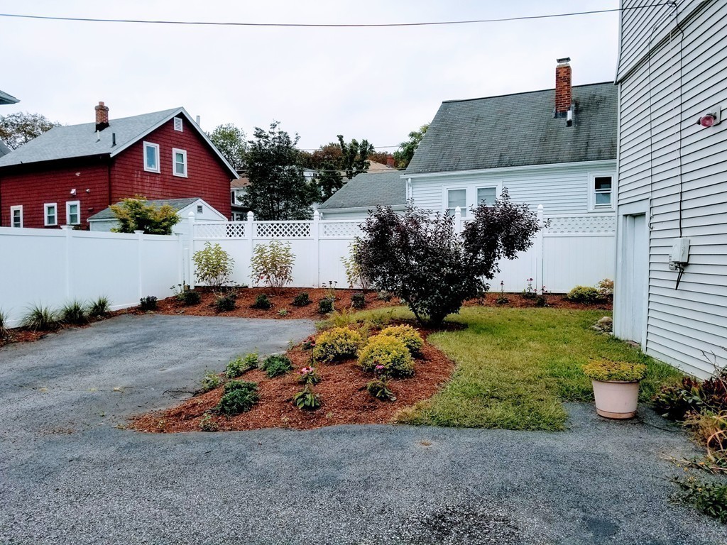 58 Dearborn Street Medford, MA 02155 - Photo 6 of 30 a front view of a house with a yard