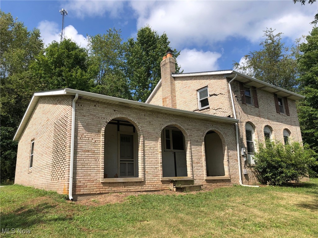 23550 Sandy Creek Road Minerva, OH 44657 - Photo 2 of 14 Side view with porch overlooking the front yard