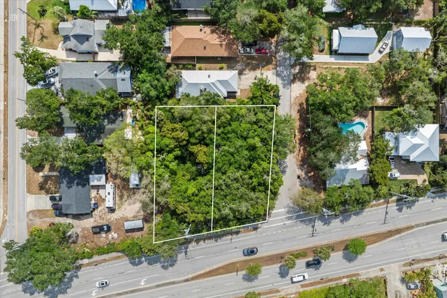 an aerial view of house with yard