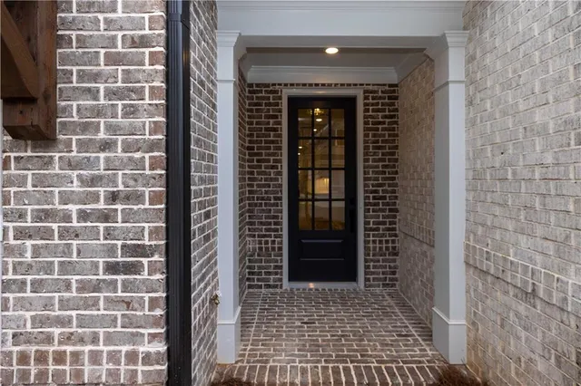 a view of a hallway with a white walls