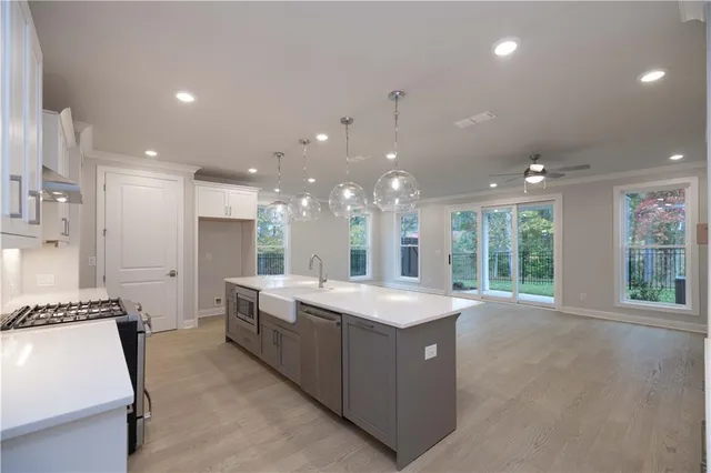 a kitchen with a sink and cabinets