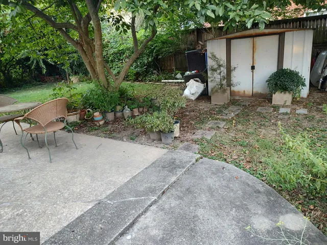 a front view of a house with a yard and a garage