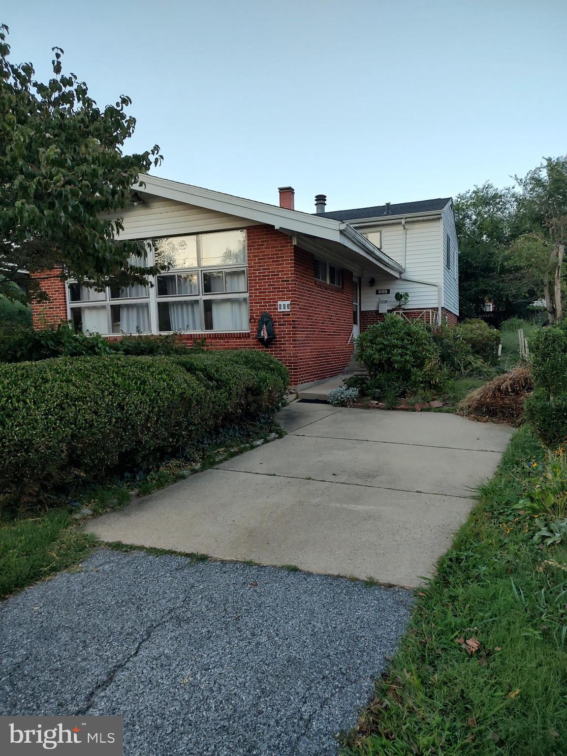 603 Perth Place Silver Spring, MD 20901 - Photo 16 of 16 a front view of a house with a yard and a garage