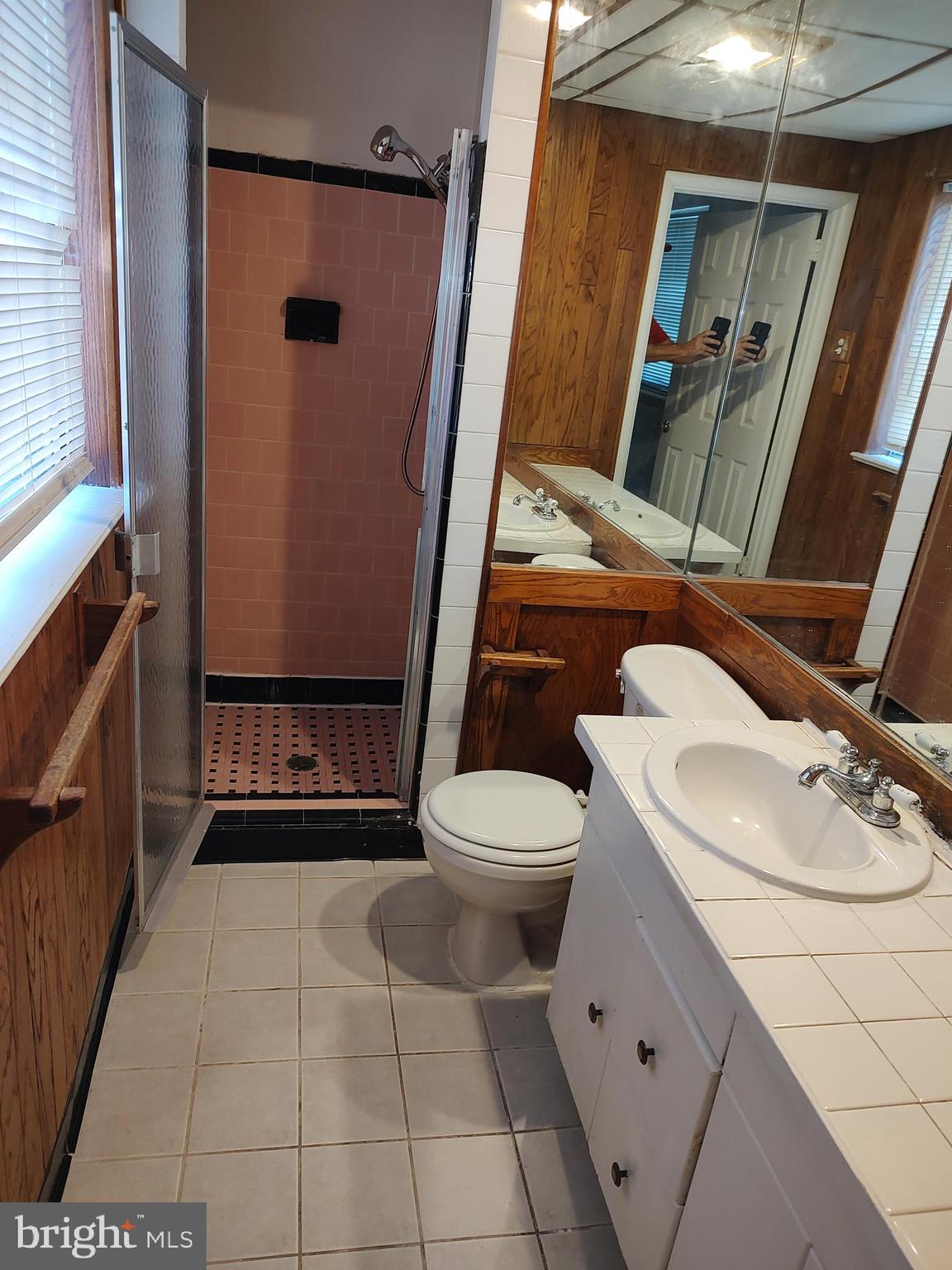 603 Perth Place Silver Spring, MD 20901 - Photo 6 of 16 a bathroom with a sink a toilet and shower