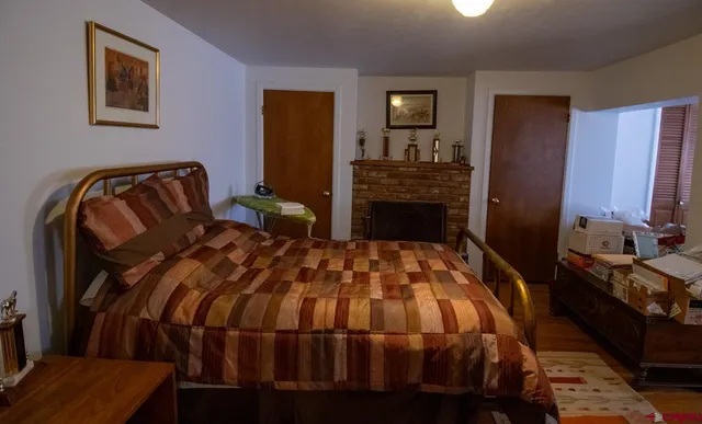 a bedroom with a bed and dresser