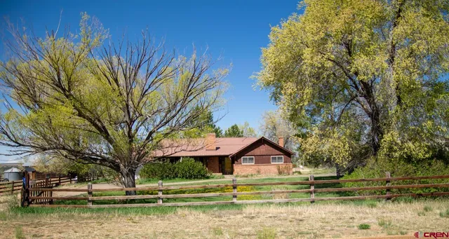 a view of roof with wooden floor and city view