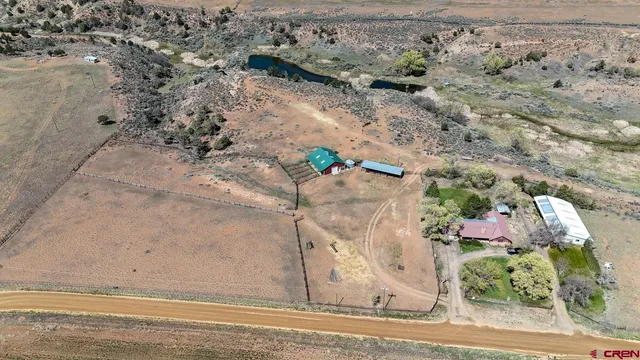 a view of a garden with wooden fence