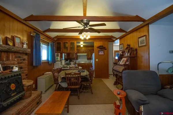 a view of a livingroom with furniture and a fireplace