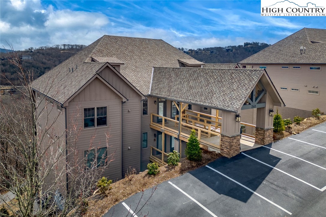 240 Ridgeline Drive, Unit D Sugar Mountain, NC 28604 - Photo 29 of 30 a view of a house with a yard