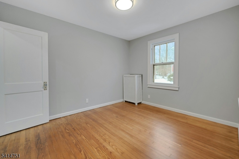 173 Runnymede Road West Caldwell, NJ 07006 - Photo 16 of 27 an empty room with windows
