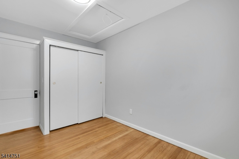 173 Runnymede Road West Caldwell, NJ 07006 - Photo 19 of 27 a view of an empty room with wooden floor