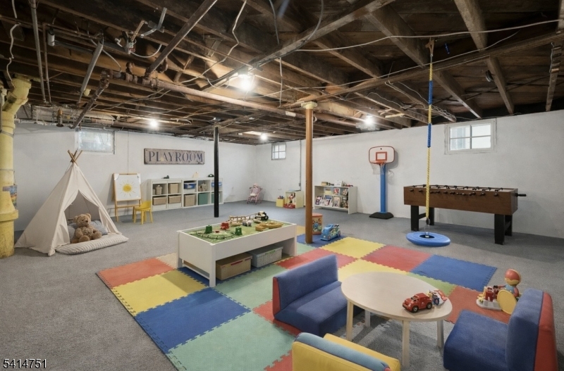173 Runnymede Road West Caldwell, NJ 07006 - Photo 21 of 27 a living room with furniture and a wooden floor