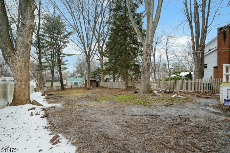 173 Runnymede Road West Caldwell, NJ 07006 - Photo 24 of 27 a view of a yard with a tree
