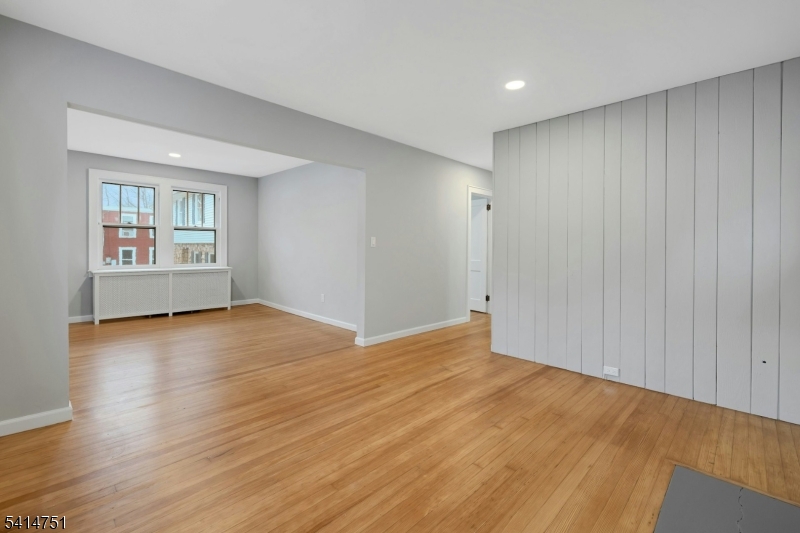 173 Runnymede Road West Caldwell, NJ 07006 - Photo 27 of 27 an empty room with wooden floor and windows