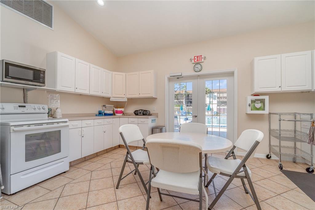 25806 Cockleshell Drive, Unit 115 Bonita Springs, FL 34135 - Photo 20 of 25 a view of kitchen with cabinets and outdoor view