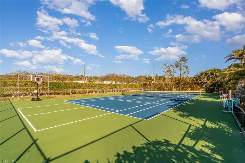 25806 Cockleshell Drive, Unit 115 Bonita Springs, FL 34135 - Photo 24 of 25 a view of an outdoor space and tennis court