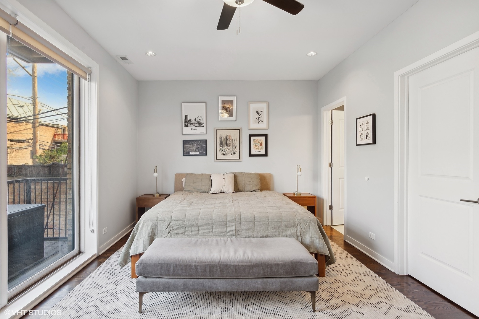 2136 West North Avenue, Unit 2E Chicago, IL 60647 - Photo 16 of 22 a bedroom with a bed and glass windows