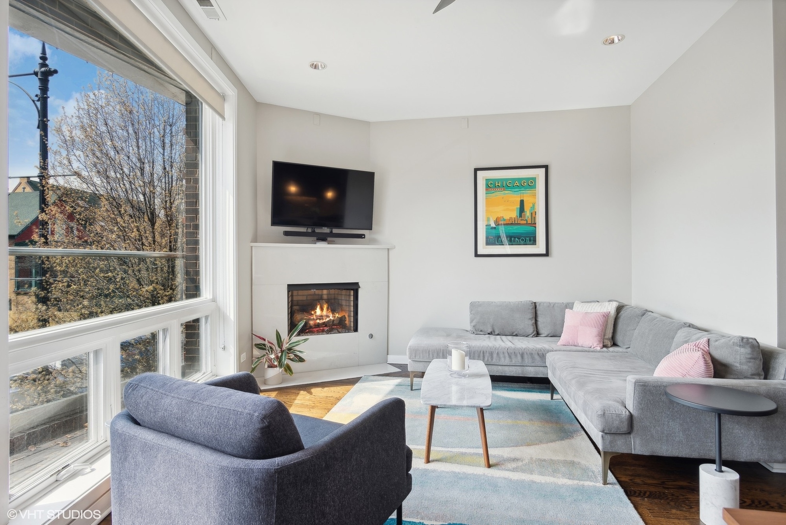 2136 West North Avenue, Unit 2E Chicago, IL 60647 - Photo 6 of 22 a living room with furniture a flat screen tv and a fireplace