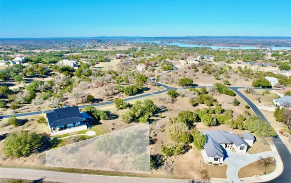 an aerial view of residential building and ocean