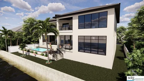 a view of a house with sitting area and garden