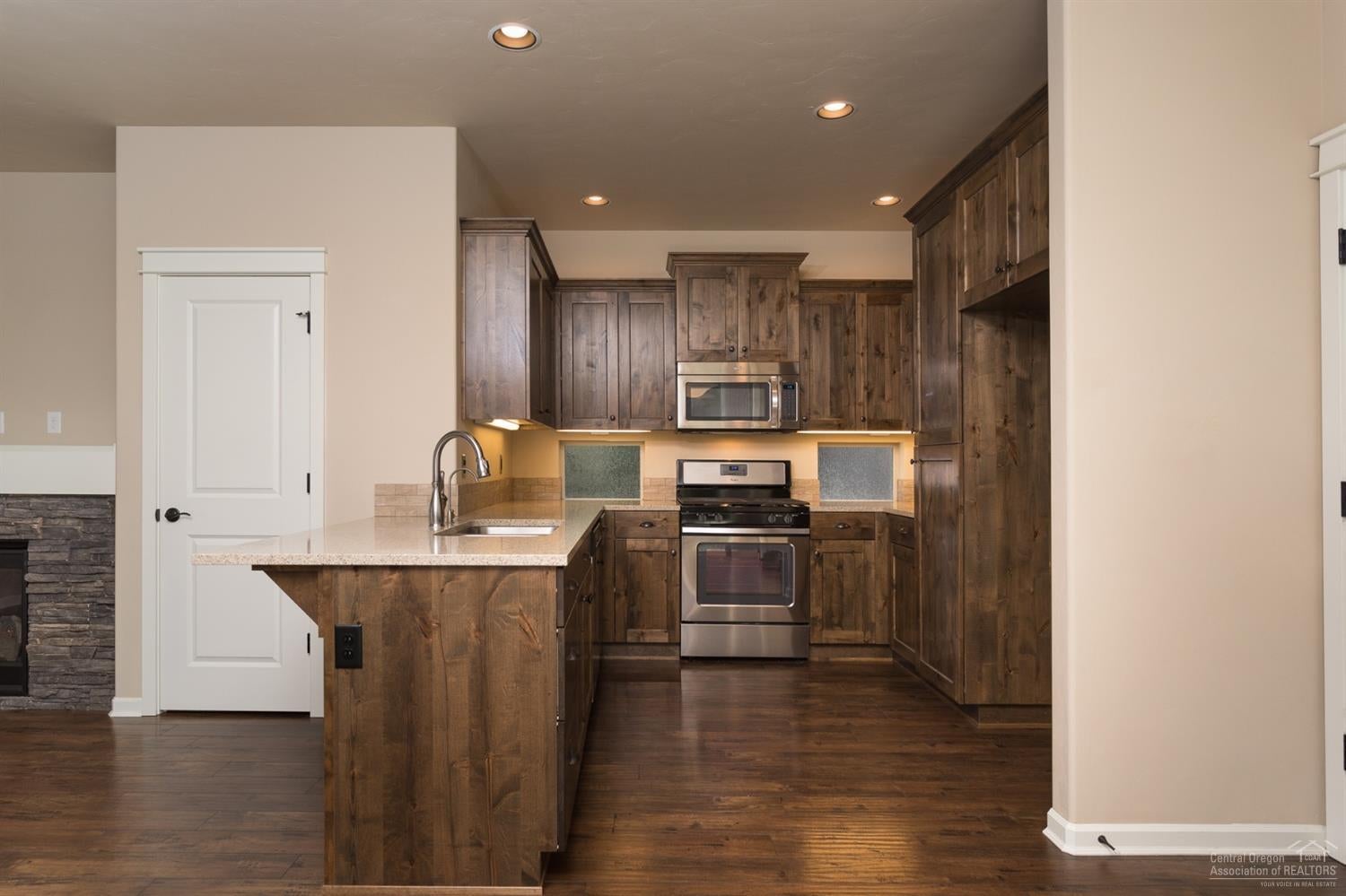 20945 Sotra Loop Bend, OR 97702 - Photo 4 of 25 Knotty alder cabinetry, quartz counter-t