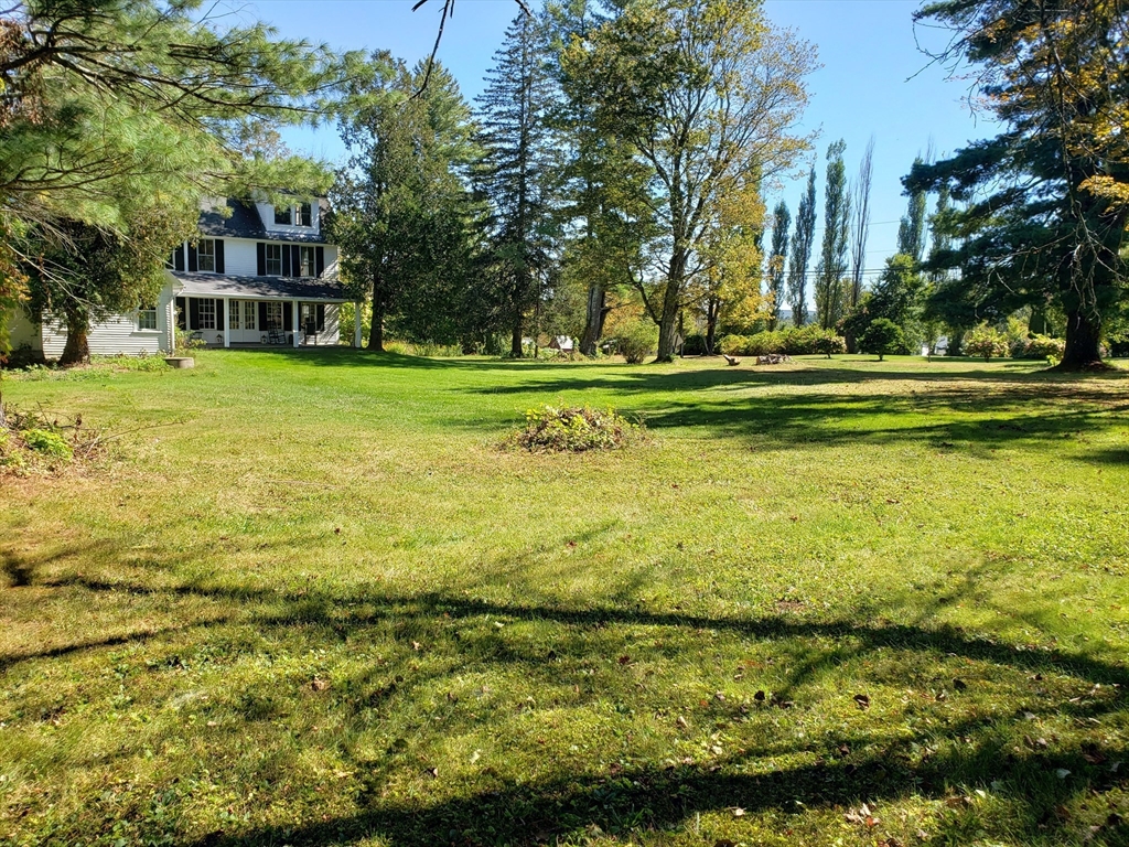 1 Searle Road Huntington, MA 01050 - Photo 11 of 42 a view of swimming pool with outdoor seating and trees